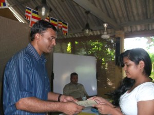 Ravindra Ranasinha presenting a Certificate of Participation 